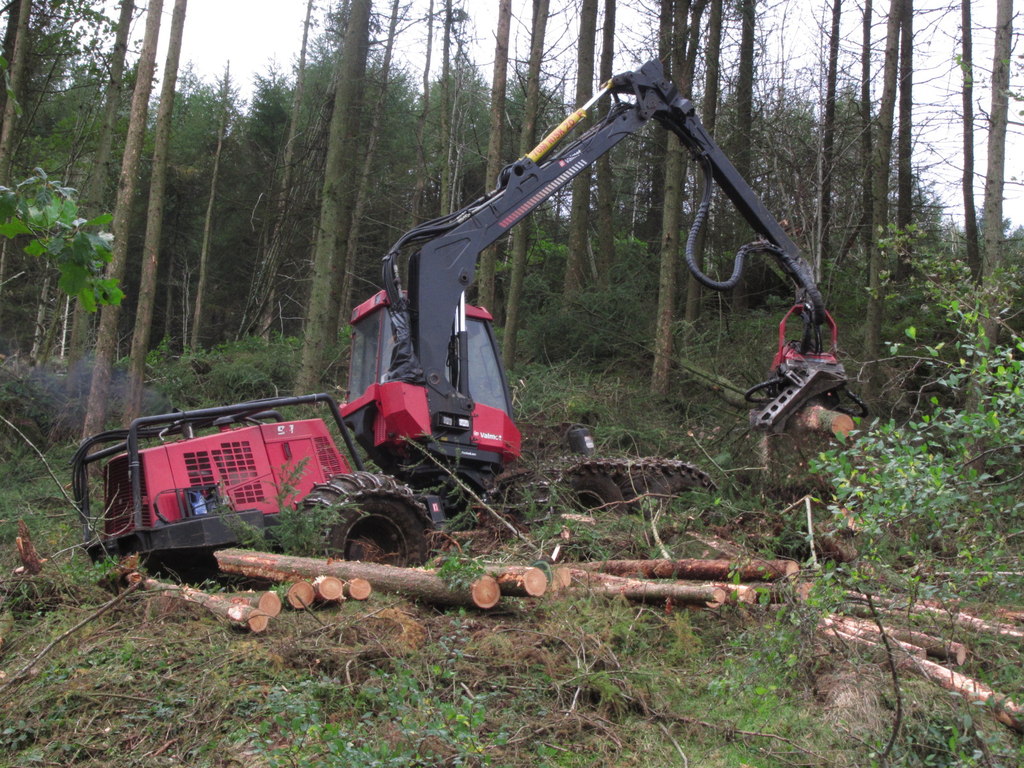 Harvester machinery clearing trees on a development site